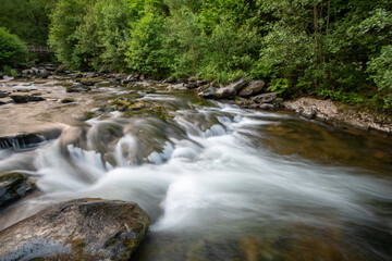 Fototapeta na wymiar Long exposure of a waterfall on the East Lyn river at Watersmeet In Exmoor National Park