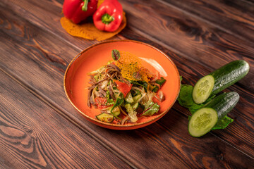 Delicious salad with boiled beef tongue, cucumber,bell pepper