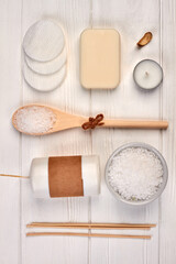 Fototapeta na wymiar Set of accessories for spa treatment on white wooden desk.