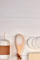 Spoon with salt and soap with copy space flat lay.