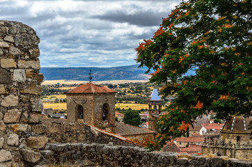 Obraz premium Bell tower framed between walls.
