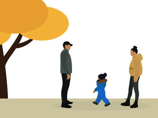 Mom, dad and child in warm clothes are walking outdoors in autumn