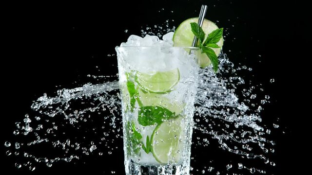 Super Slow Motion of exploding crushed ice towards mojito cocktail. Filmed on high speed cinematic camera at 1000 fps.