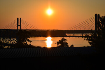 River with bridge at sunset