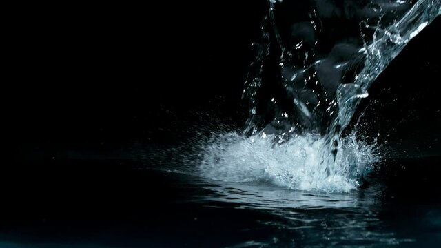 Super slow motion of water splash on black background. Filmed on high speed cinema camera, 1000 fps.