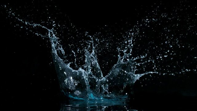 Super slow motion of water splash on black background. Filmed on high speed cinema camera, 1000 fps.