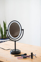 portable makeup mirror on a table