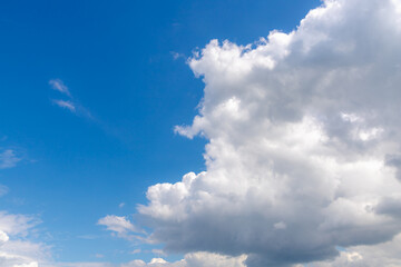 Beautiful cumulus clouds in sunny day, White fluffy cloud floating in blue sky, Cumulus clouds are clouds which have flat bases and are often described as puffy, Horizon nature background.