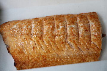 Grilled salmon on a barbecue in Brazil. with coarse salt