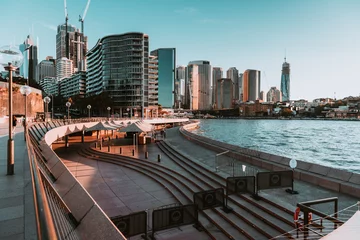 Poster "Sydney, NSW / Australia - April 17, 2020: Sydney Opera House and Circular Quay surroundings completely isolated and with social distancing under lockdown due to Coronavirus outbreak" © Juan