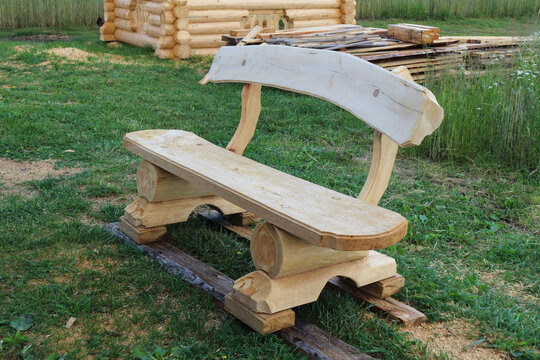 wooden bench, handmade, on the green grass