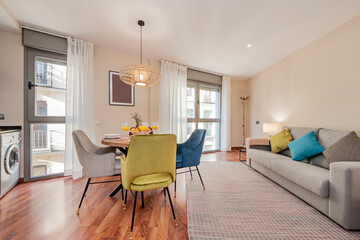 Living room decorated and with the table set a vacation rental apartment with stamped and colored velvet