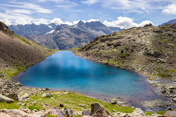 Hiking trail in Aosta valley. Lac Long, a beautiful alpine lake in Valpelline, Aosta, Italy