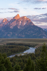 Vertical shot of mountains and a river in Grand Teton National Park in Wyoming, USA