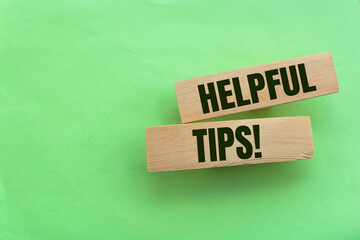Text helpful tips from wooden blocks, advice or information concept