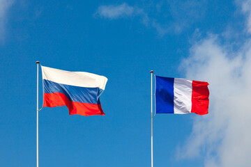 Flag of Russia and flag of France are on blue sky. Concept partnership, collaboration - 445061335