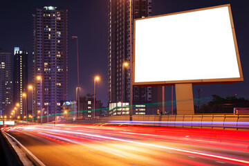 blank billboard on light trails, street and urban in the night - can advertisement for display or...