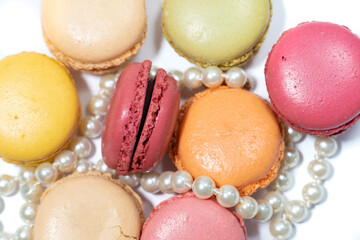 French desserts macarons and necklace white pearl jewellery