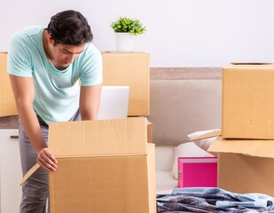 Young man moving to new apartment