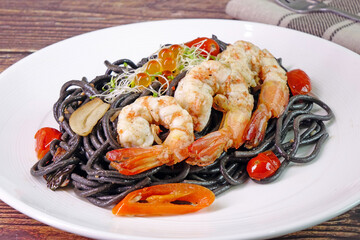 Squid ink spaghetti with prawn. Italian  food. Selective focus