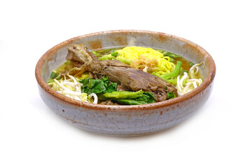 Brasied duck noodle soup isolated on white background. Famous Asian food in China, Singapore, Thailand, and Vietnam