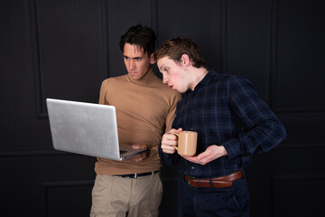 Two students are aware and watch the news.