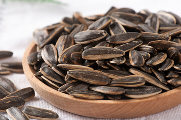 sunflower seeds on a wooden plate