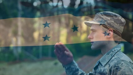 Digital composition of waving honduras flag against soldier saluting at training camp - Powered by Adobe