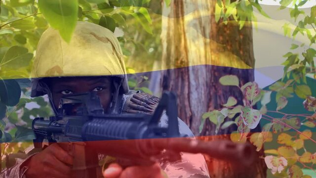 Digital composition of waving colombia flag against soldier training with a gun at training camp