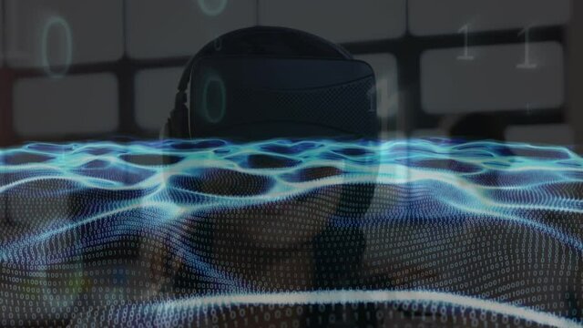 Animation of waves of binary coding over woman wearing vr headset
