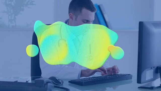 Animation of green and yellow splash over male doctor using computer