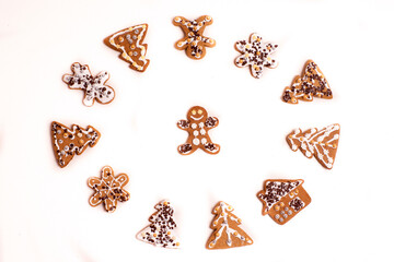 Gingerbread cookies lying on a white background arranged in the shape of a circle.