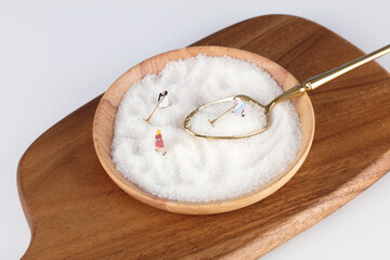 Miniature doll model of working on sugar