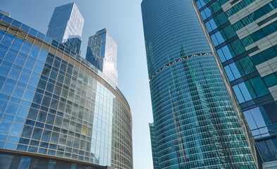 reflections of skycrapers in another skyscraper of moscow city