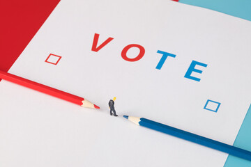 Businessman thinking about how to choose among colored pencils