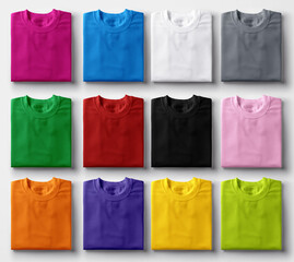 Folded colorful t-shirts on white background. - obrazy, fototapety, plakaty