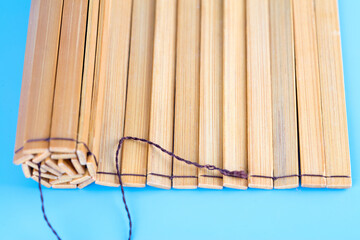 Blank ancient bamboo slips on blue background