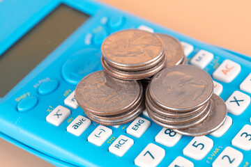 Dollar coin and calculator business concept
