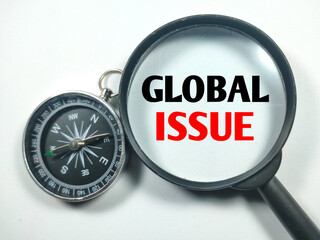 Business concept.Text GLOBAL ISSUE on magnifying glass with compass on white background.