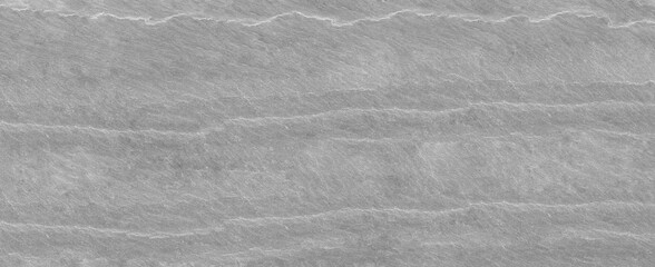 Abstract stone background. The texture of the stone wall. Close-up. Light gray rock backdrop