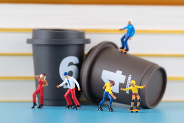 Miniature world roller skater and coffee cup