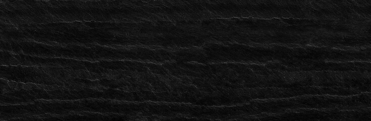 Panorama black rock background. Dark gray stone texture. Black grunge background.