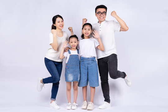 Portrait Of Asian Family On White Background