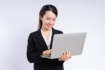 Young Asian businesswoman using laptop on white background