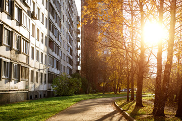 Autumn park near the building in the sun,