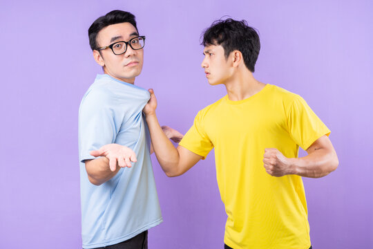 Two Asian Brothers Arguing With Each Other