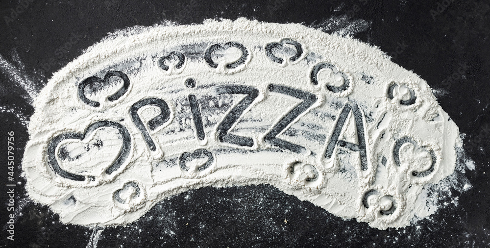 Poster word pizza and heart is written on flour, top view. abstract baking background