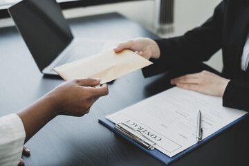 Businessmen make an agreement with the money proposed his partner to bribe in the company. The concept of bribery and corruption