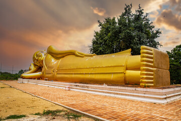 Wat Aranyikawas temple, reclining buddha and pagoda, in Chon Buri, Thailand - obrazy, fototapety, plakaty