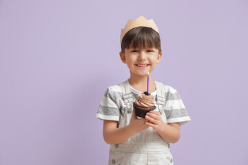 Cute little boy with Birthday cake on color background